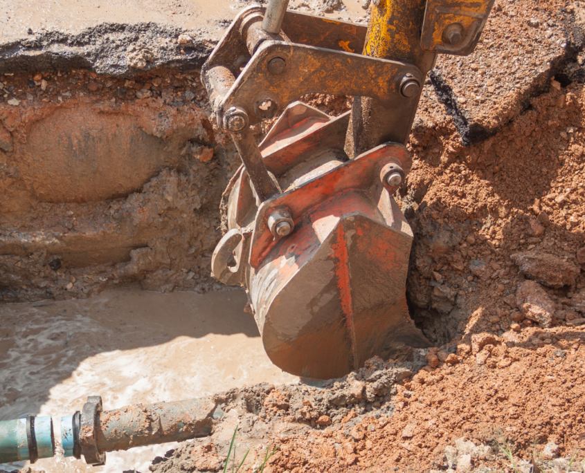 Excavator, bulldozer work a hole the repair of pipe water